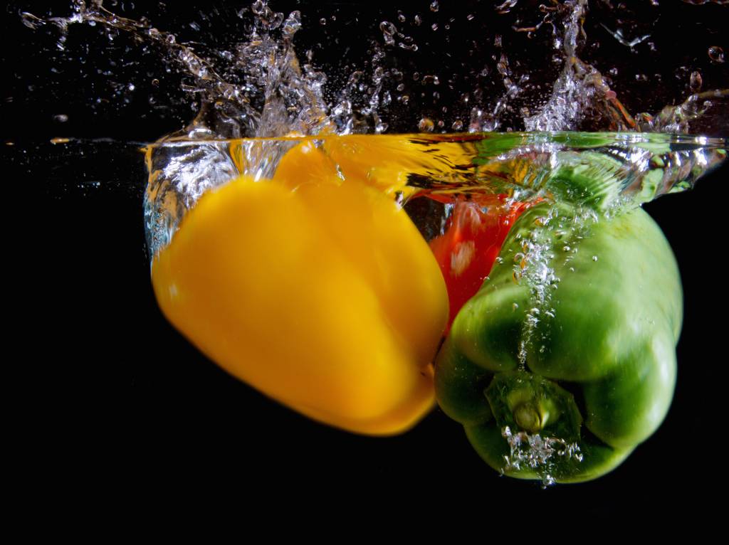 Peppers falling into Water